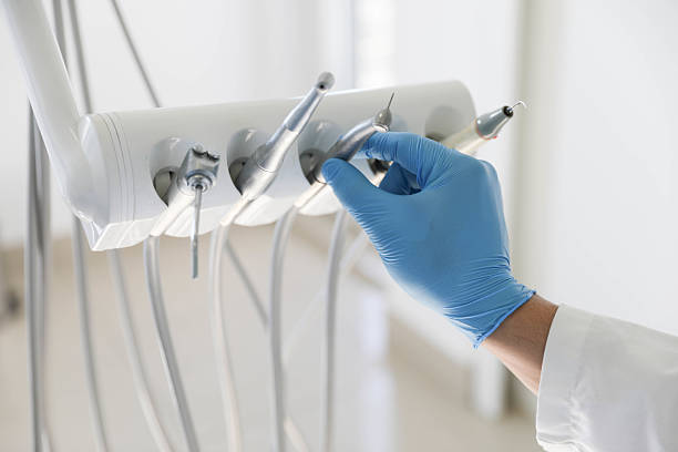 Professional Tooth Extraction technician working in Mills River, NC